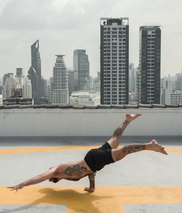 Strong man performing static power practice outdoors